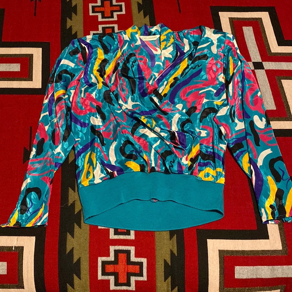 Vintage 80’s Neil Martin Top size 10. Has elastic waist/shoulder pads